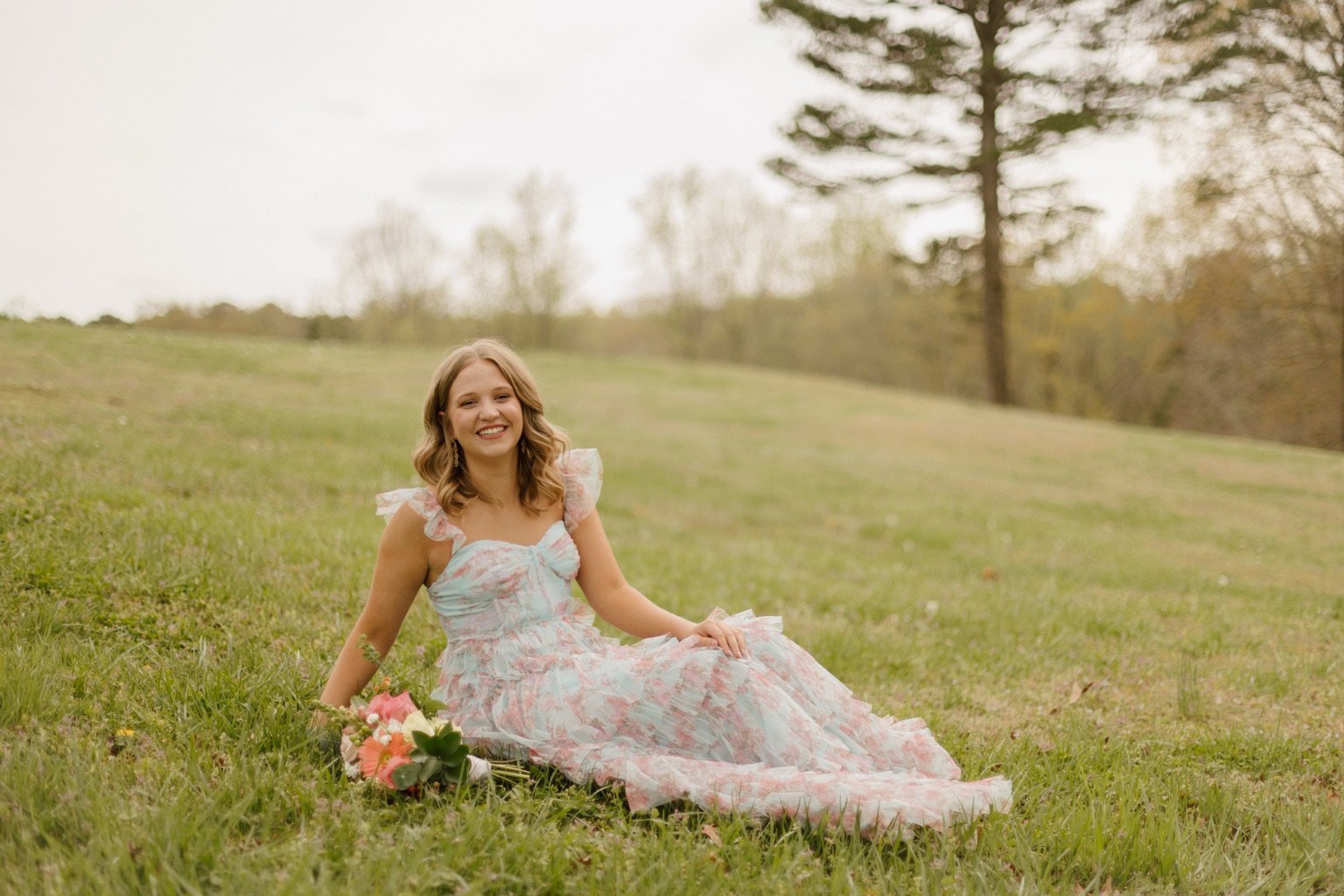 Clara in a floral dress outdoors