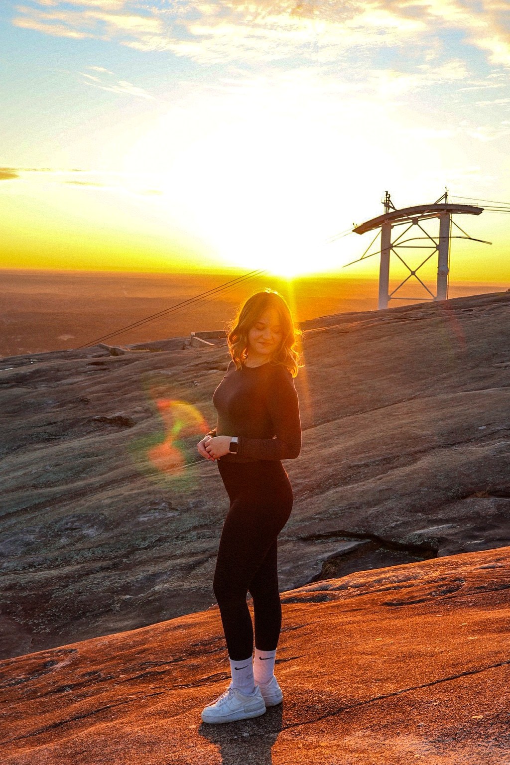 Clara at sunset on a mountain