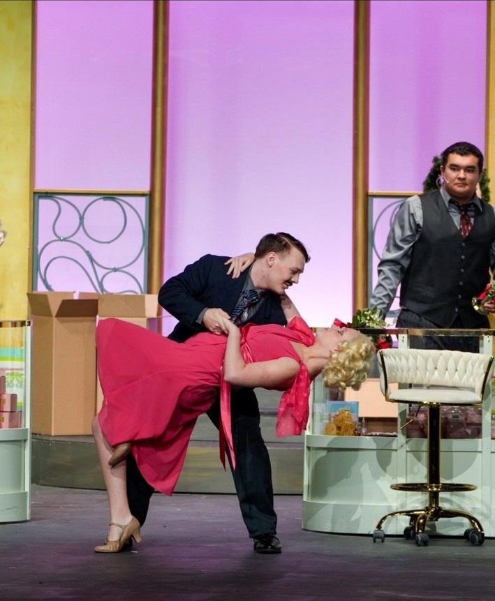 Clara as Ilona Ritter in a comedic dance dip